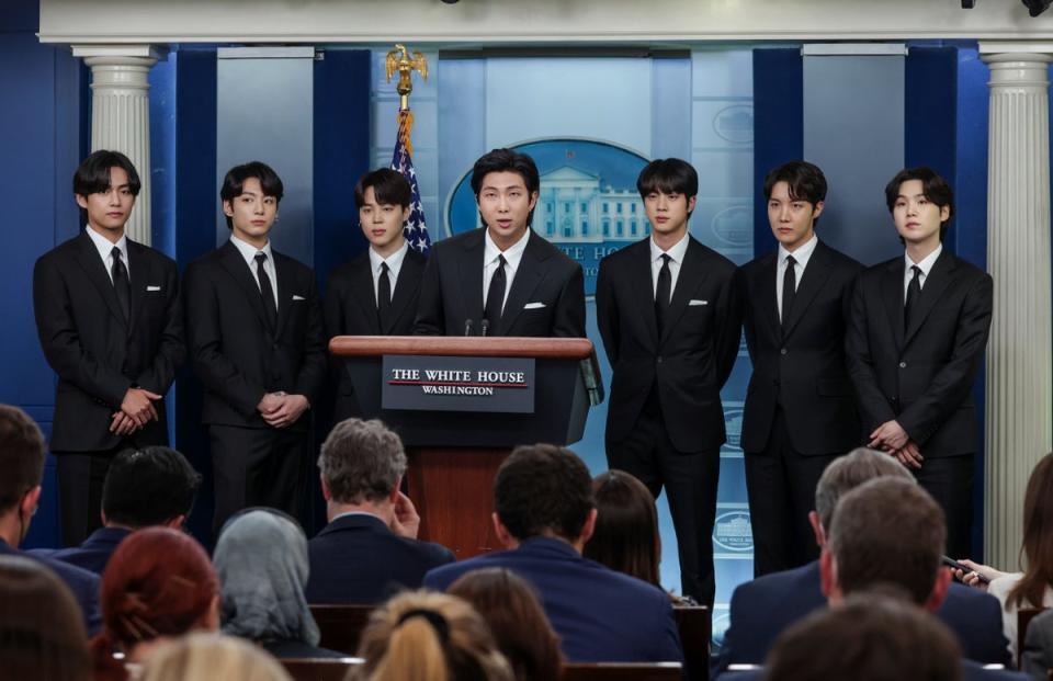 V, Jungkook, Jimin, RM, Jin, j-hope and Suga of BTS speak at the White House in Washington DC on 31 May 2022 (Getty)
