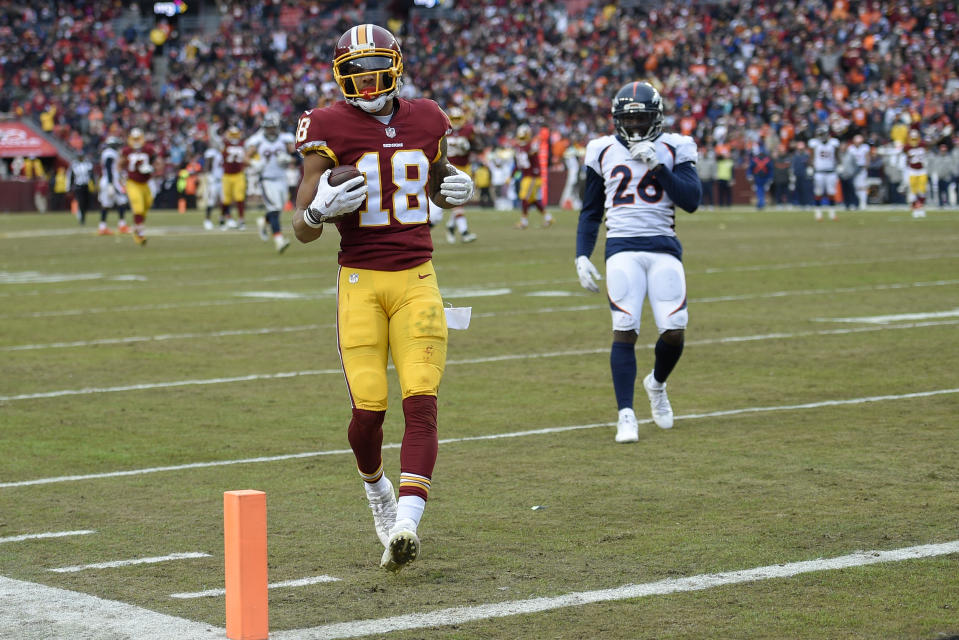 Washington Redskins wide receiver Josh Doctson (18) carries the ball into the end zone for a touchdown during the second half an NFL football game against the Denver Broncos in Landover, Md., Sunday, Dec 24, 2017. (AP Photo/Nick Wass)