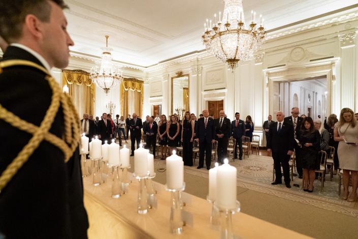 President Donald J. Trump and First Lady Melania Trump join guests in singing &#x00201c;America the Beautiful&#x00201d; during a reception in honor of Gold Star Families Sunday, Sept. 27, 2020, in the East Room of the White House.
