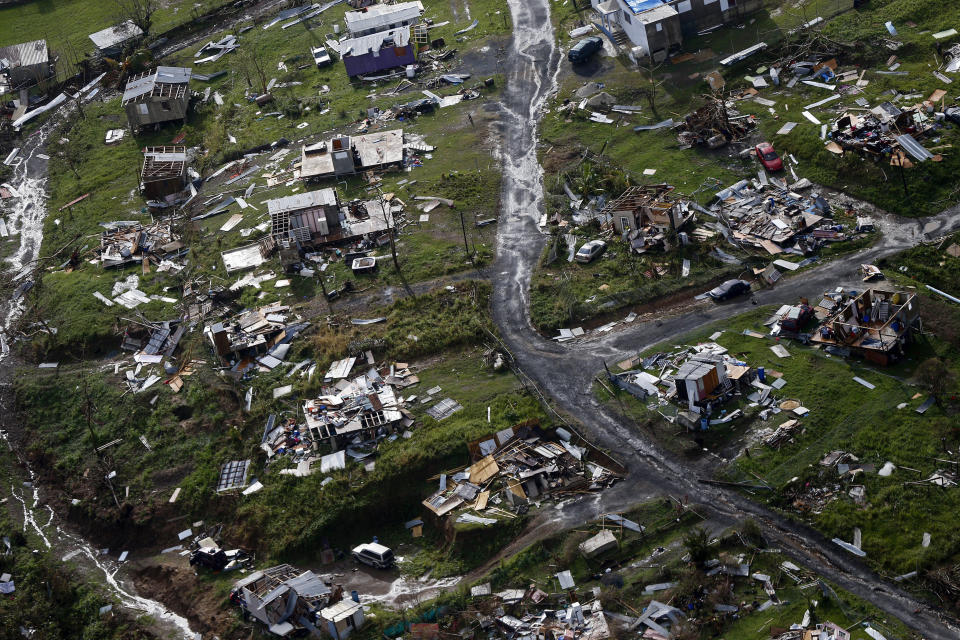FILE - Destroyed communities are seen in the aftermath of Hurricane Maria on Sept. 28, 2017, in Toa Alta, Puerto Rico. Five years after Hurricane Maria slammed into Puerto Rico and exposed the funding problems the Caribbean island has long faced, philanthropists warn that many of those issues remain unaddressed, just like the repairs still needed for the American territory’s physical infrastructure. (AP Photo/Gerald Herbert, File)