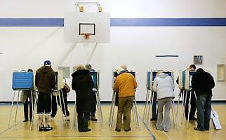 Voters cast their ballots Tuesday in Ohio’s primary election at a polling station in Cleveland Heights.Amy Sancetta | Associated Press