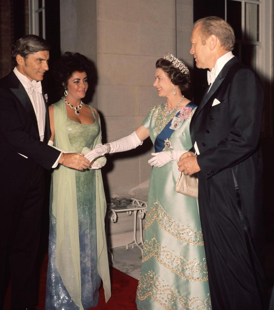 Elizabeth Taylor and Jack Warner: The Queen shakes hands with Jack Warner, the future husband of Elizabeth Taylor, at the British Embassy reception in Washington, 1976 (Rex Features)