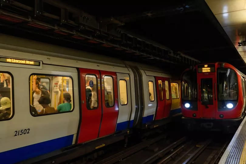 District line trains are seen entering the platform at Embankment Underground Station