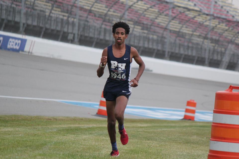 Defending his individual title in the MHSAA Division 4 boys’ cross-country race, Lezawe Osterink of Wyoming Potter’s House approaches the finish line at Michigan International Speedway. His winning time was 15:36.84.