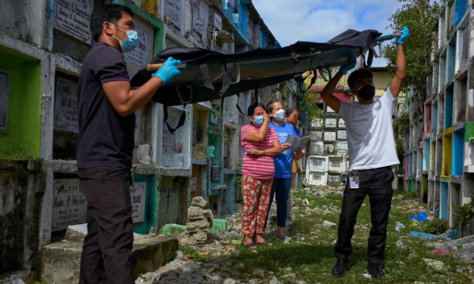 An extrajudicial killing victim’s body is exhumed at a Manila cemetary