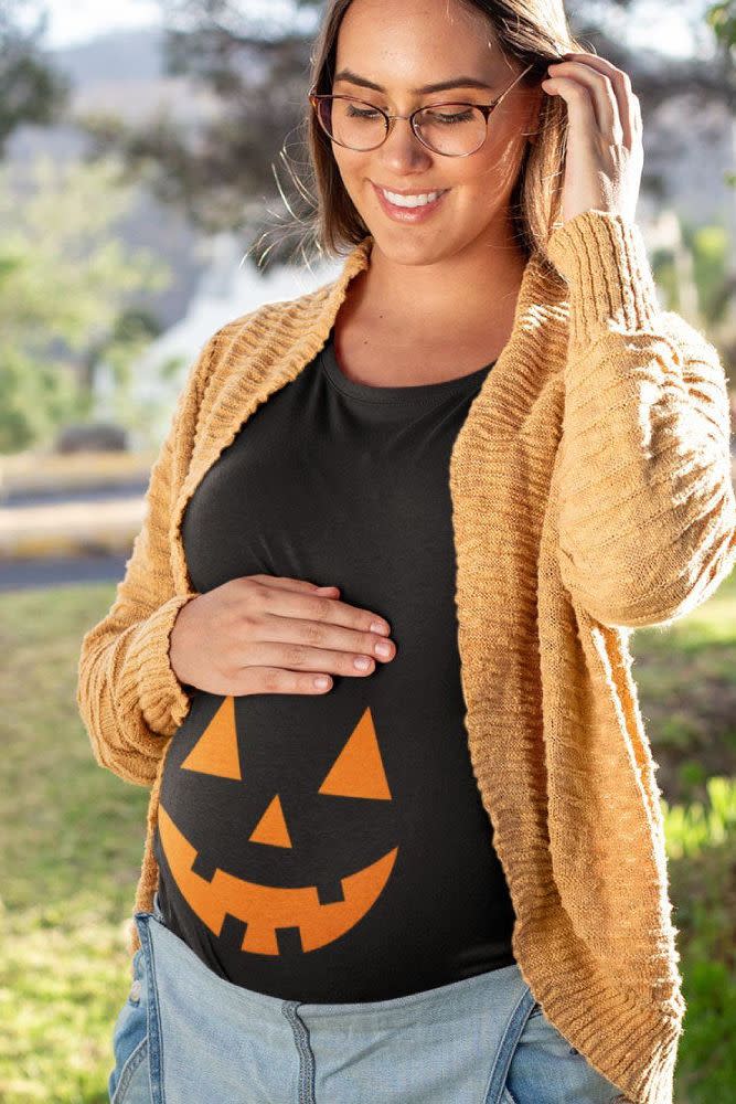 <p>If you're not feeling up to go all out, throw on this comfy, ruched jack o' lantern maternity t-shirt.</p><p> <a class="link " href="https://go.redirectingat.com?id=74968X1596630&url=https%3A%2F%2Fwww.etsy.com%2Flisting%2F855705787%2Fjack-o-lantern-pumpkin-maternity-shirt&sref=https%3A%2F%2Fwww.goodhousekeeping.com%2Fholidays%2Fhalloween-ideas%2Fg3836%2Fhomemade-pregnant-halloween-costumes%2F" rel="nofollow noopener" target="_blank" data-ylk="slk:SHOP PUMPKIN SHIRT;elm:context_link;itc:0;sec:content-canvas">SHOP PUMPKIN SHIRT</a> </p>