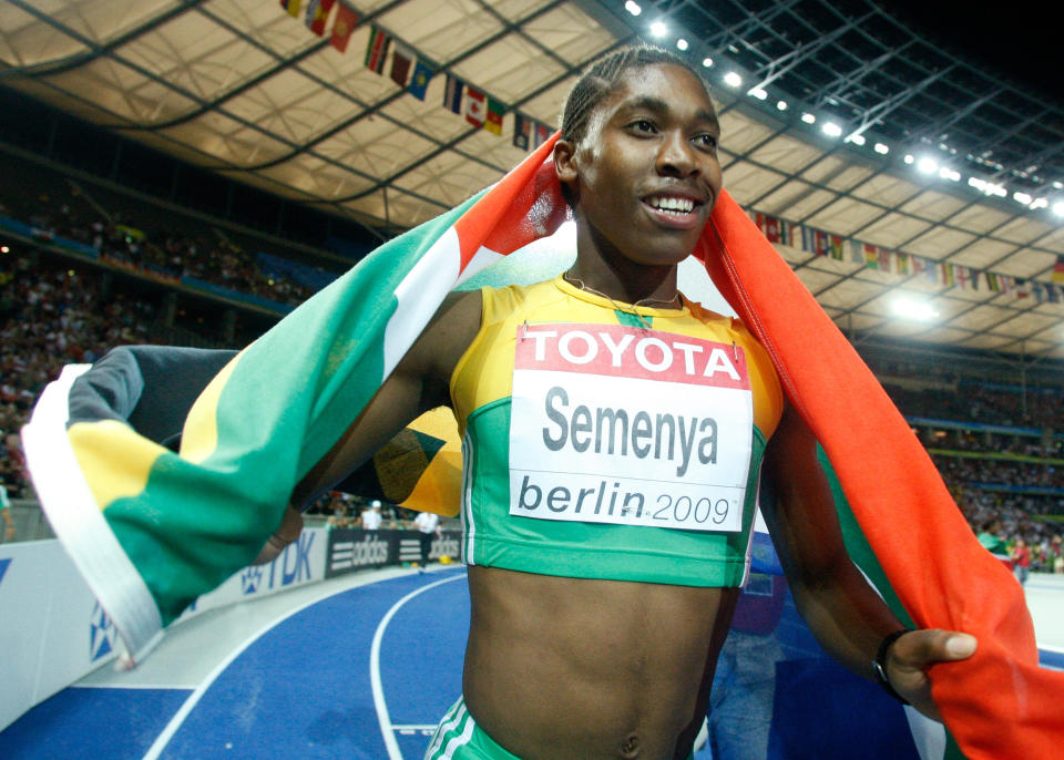 Caster Semenya of South Africa celebrates after winning the women's 800 metres final during the world athletics championships at the Olympic stadium in Berlin August 19, 2009.   REUTERS/Dominic Ebenbichler (GERMANY SPORT ATHLETICS)