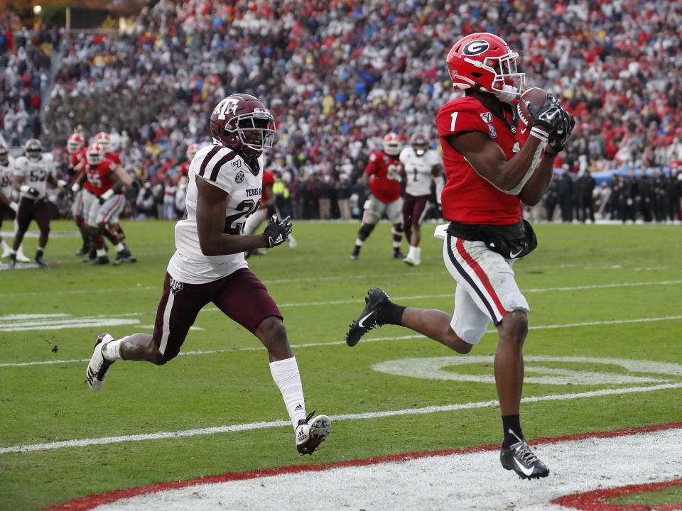 Georgia wide receiver George Pickens (1) makes a catch for a touchdown as Texas A&M defensive back Debione Renfro (29) defends in the first half of an NCAA college football game Saturday, Nov. 23, 2019, in Athens, Ga. (AP Photo/John Bazemore)