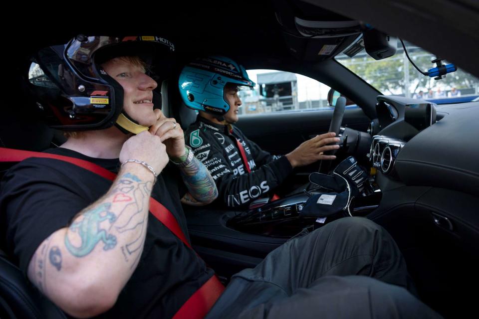 <p>Motorsport Images / SplashNews.com</p> Ed Sheeran and George Russell at the Formula One Miami Grand Prix