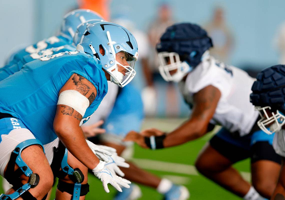 North Carolina offensive lineman Zach Rice lines up during a drill at UNC’s first football practice of the season on Friday, July 29, 2022, in Chapel Hill, N.C.