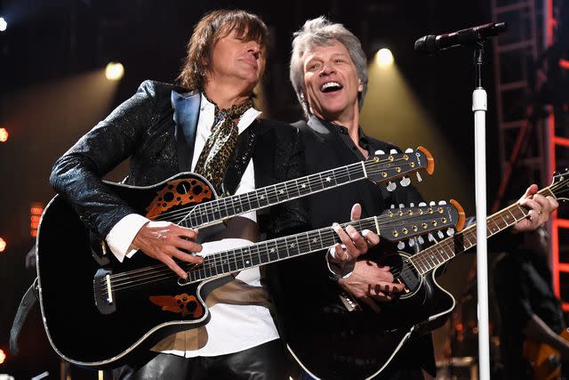 <p>Kevin Mazur/Getty</p> Richie Sambora and Jon Bon Jovi of Bon Jovi perform during the Rock & Roll Hall of Fame Induction Ceremony in April 2018 in Cleveland, Ohio