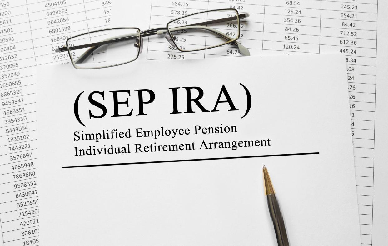 Paper with Simplified Employee Pension Individual Retirement Arrangement SEP IRA on a table