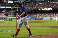 Boston Red Sox's Xander Bogaerts walks to the dugout after striking out against the Houston Astros during the seventh inning in Game 6 of baseball's American League Championship Series Friday, Oct. 22, 2021, in Houston. (AP Photo/Tony Gutierrez)