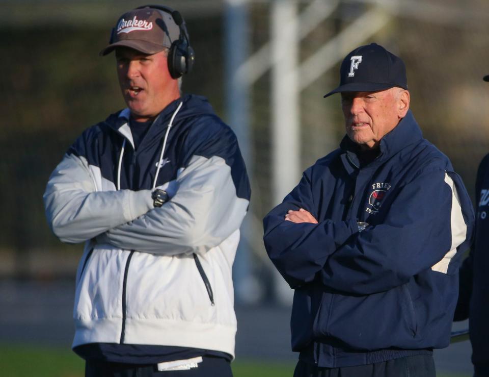 Wilmington Friends' head coach Rob Tattersall (left) works next to his father, former head coach Bob Tattersall, in the Quakers' 49-12 win in the DIAA Class 2A state tournament quarterfinals at Abessinio Stadium, Friday, Nov. 25, 2022.
