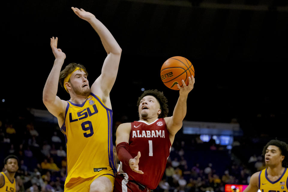 Alabama guard Mark Sears (1) shoots against LSU forward Will Baker (9) during the second half of an NCAA college basketball game in Baton Rouge, La., Saturday, Feb. 10, 2024. (AP Photo/Matthew Hinton)