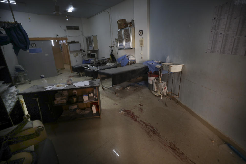 Blood is seen on a hospital floor in Atareb, a town in rural western Aleppo, Syria, Sunday, March 22, 2021. Artillery shells fired from government areas killed at least five civilians and wounded medical staff when they landad in front of the hospital. (AP Photo/Ghaith Alsayed)