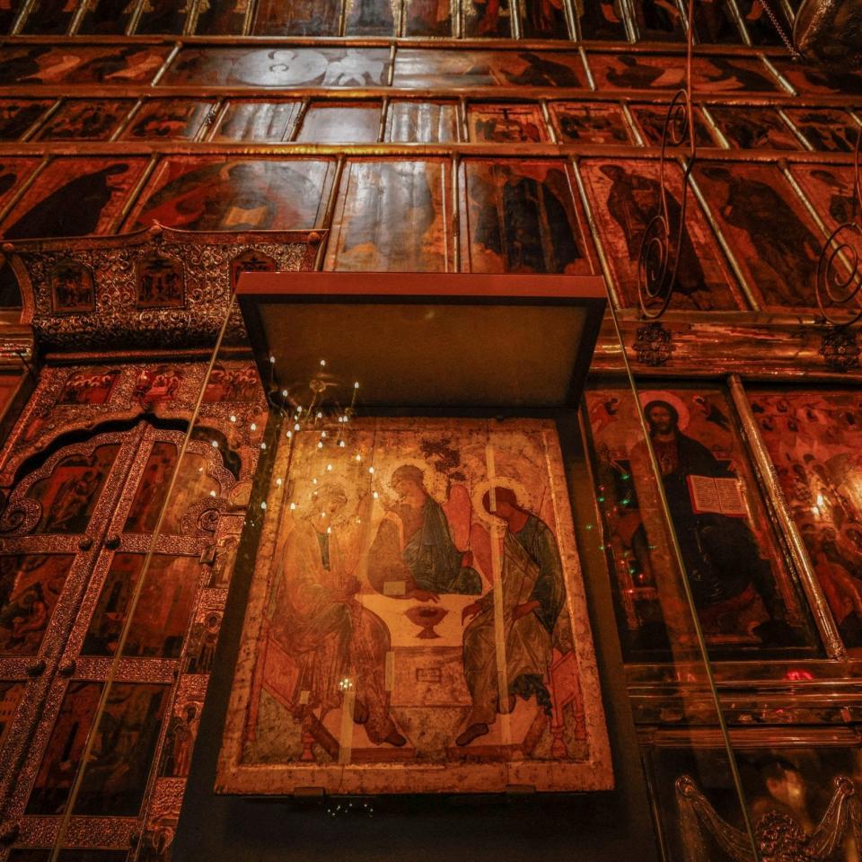 The Trinity icon is seen behind safety glass at the Trinity Lavra - Reuters