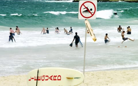 A proposal to ban surfing on most of Australia's iconic Bondi Beach has triggered anger among the local boarding community - Credit:  RICK RYCROFT/AP