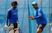 Cricket - Sri Lanka v India - India's Team Practice Session - Galle, Sri Lanka - July 25, 2017 - India's cricketer Rohit Sharma is advised by team's coach Ravi Shastri ahead of their first test match. REUTERS/Dinuka Liyanawatte