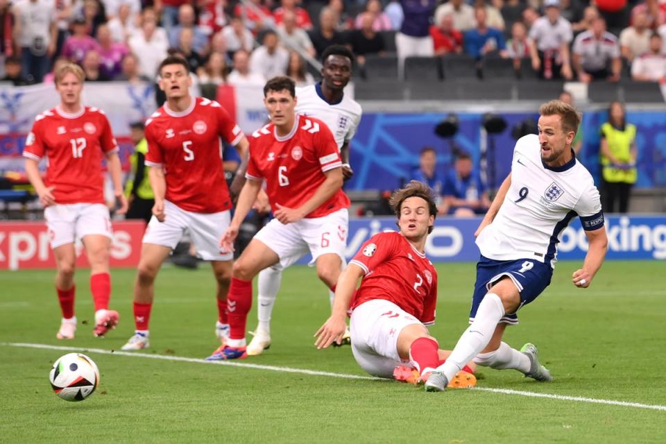 Kane slides the ball into the corner of Denmark’s goal (Getty Images)