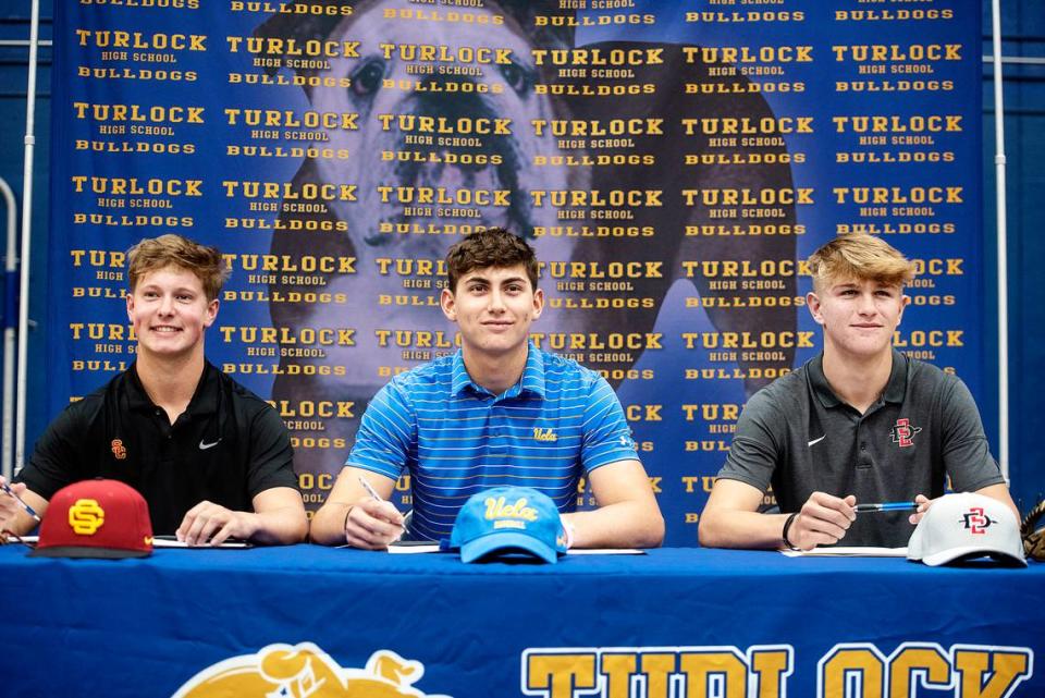 Turlock High School seniors, from the left, Andy Owen, Tyler Soderstrom and Cole Carrigg signed their National Letters of Intent at Turlock High School in Turlock, Calif., Wednesday, Nov. 13, 2019. Owen is heading to USC, Soderstrom is going to UCLA and Carrigg will attend San Diego State.