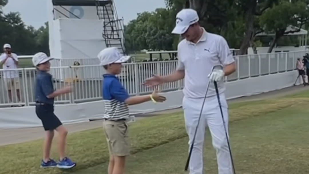  Emiliono Grillo invites two young fans to take shots with him at the 2023 Charles Schwab Challenge 