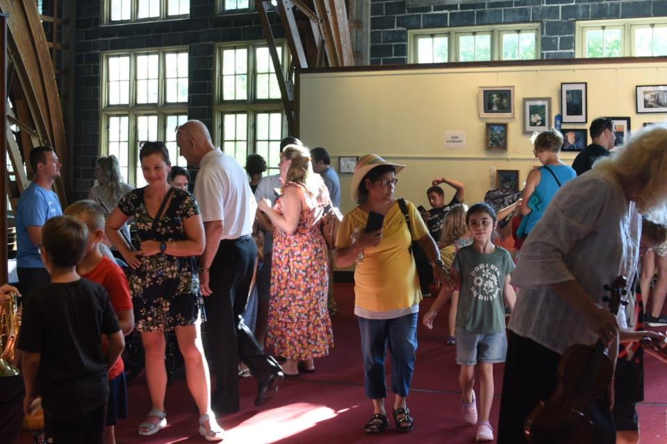 Children and parents gathered at Hoover Auditorium in Lakeside for an “Instrument Petting Zoo” as part of the Chautauqua’s music appreciation event at Lakeside. Later on the Lakeside Symphony Orchestra performed a family concert of “Our Amazing Earth.”