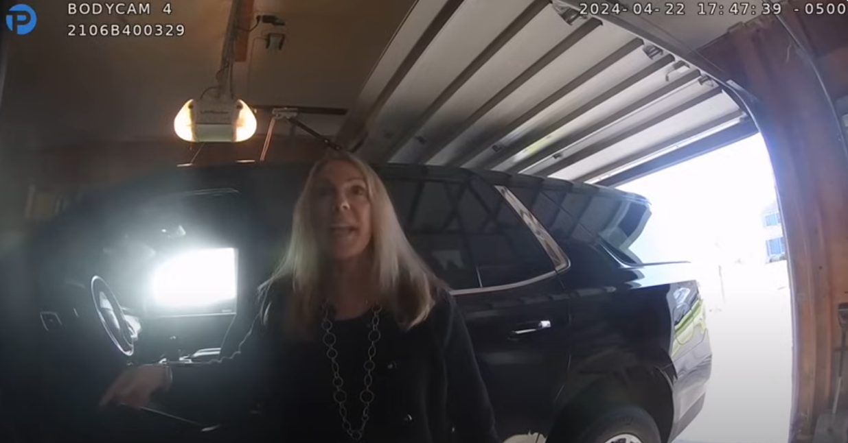 A video shows Sandra Doorley refusing to follow Officer Cameron Crisafulli’s commands and cursing at him while wandering in and out of the garage of her home and at one point entering her home on Fallen Leaf Terrace in Webster, where the stop ended.