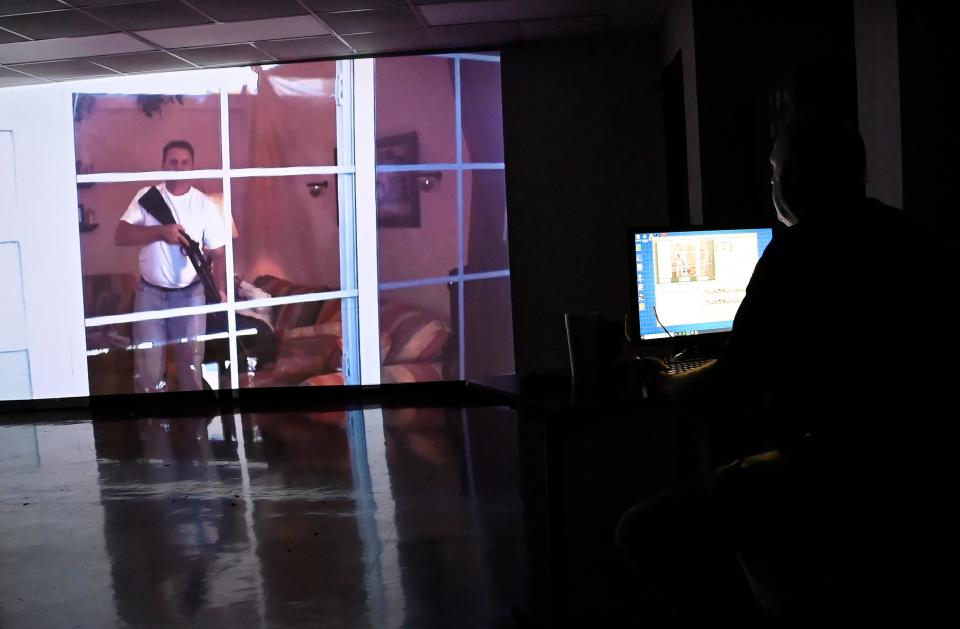 Firearms simulator instructor Trey Clinton explains how an active shooter scenario is used at the Tennessee Law Enforcement Training Academy Thursday, June 27, 2024, in Nashville, Tenn.