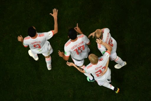 Spain forward Diego Costa (centre) is congratulated by teammates after scoring against Spain