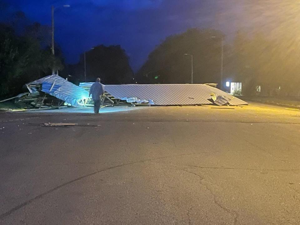 The roof to Sandy's Bar & Grill in Conde was blown into the street following high winds early in the morning hours Monday.