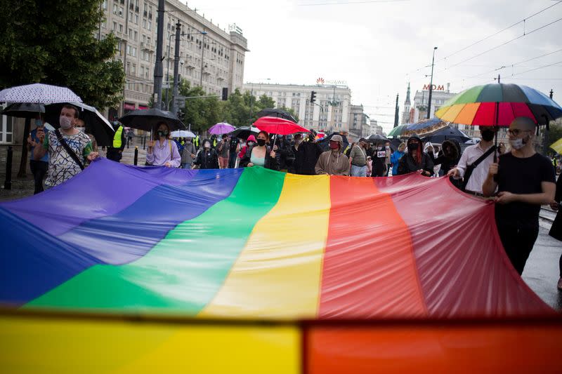 People participate in an anti-government demonstration in Warsaw