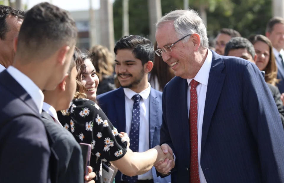 Elder Neil L. Andersen greets Latter-day Saints after the dedication of the Brasília Brazil Temple on Sept. 17, 2023.