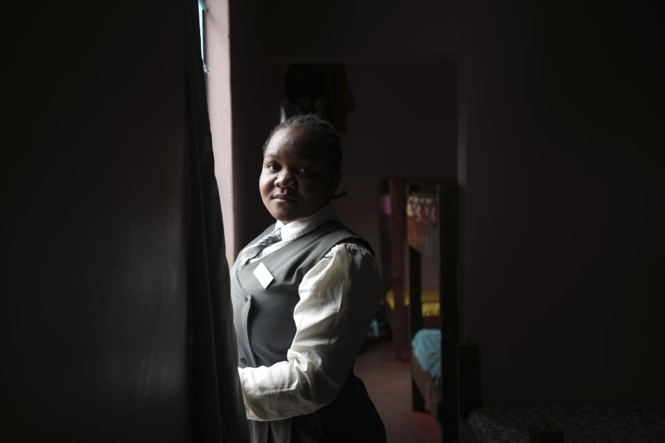 Bridget Chanda poses inside her dormitory at Chileshe Chepela Special School in Kasama, Zambia, Thursday, March 7, 2024. Chanda is intent on helping educate Zambia’s deaf community about climate change. As the southern African nation has suffered from more frequent extreme weather, including its current severe drought, it’s prompted the Zambian government to include more climate change education in its school curriculum. (AP Photo/Tsvangirayi Mukwazhi)
