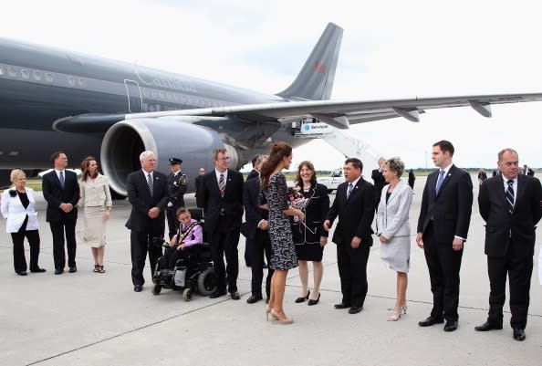 Royals shake hands after landing