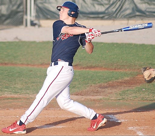 A Bartlesville Doenges Ford Indians batter launches a prodigious shot during American Legion play in the first decade of the 2000s.