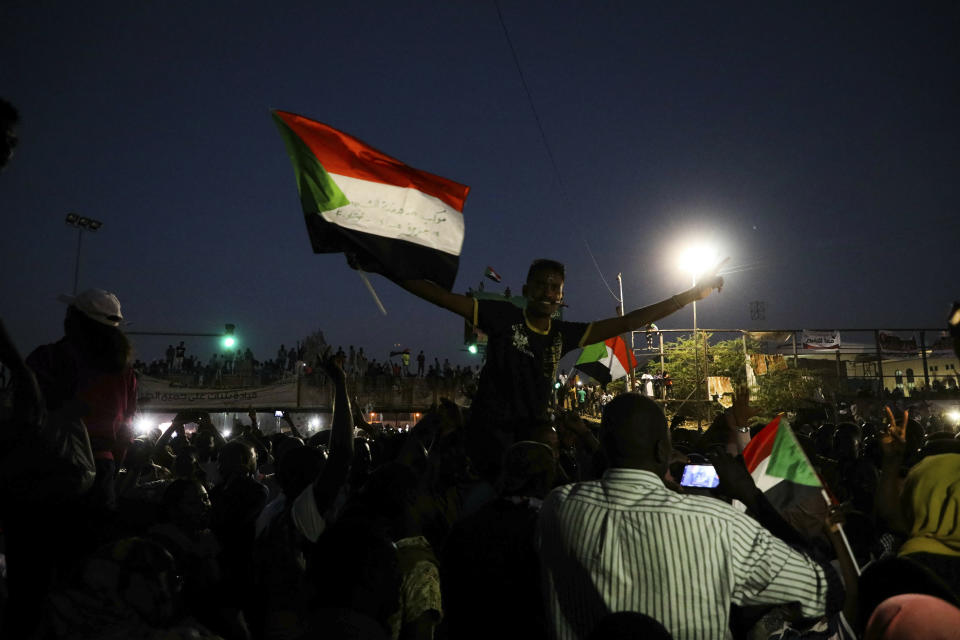 Sudanese protesters chant slogans during a rally outside the army headquarters in Sudan's capital Khartoum on Saturday, April 20, 2019. Sudan's military ousted President Omar al-Bashir following four months of street protests against his rule, then appointed a military council it says will rule for no more than two years while elections are organized. Protesters fear the army, dominated by al-Bashir appointees, will cling to power or select one of its own to succeed him.(AP Photo)