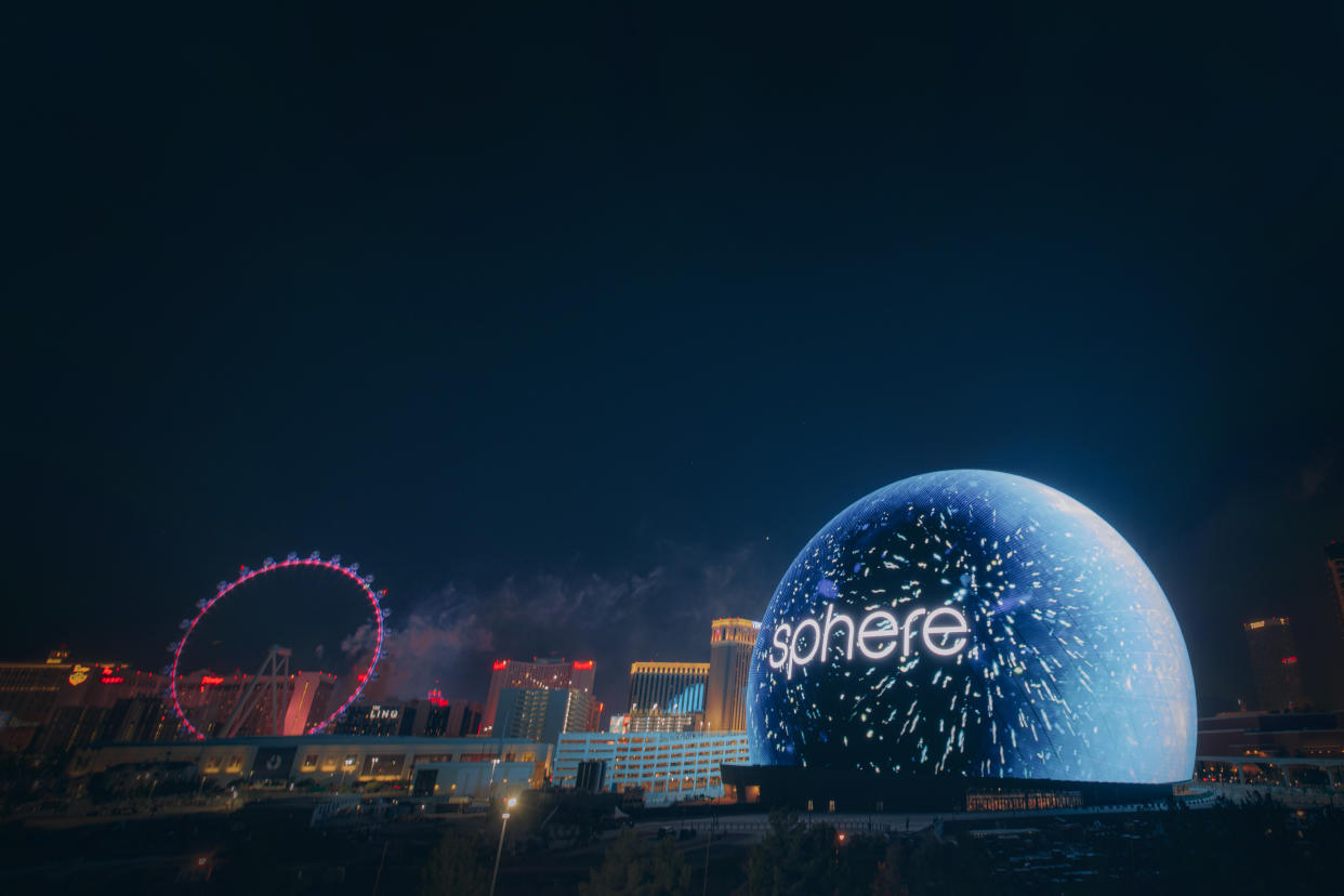  A GIF of a hockey player slapshotting a puck with the NHL Draft logo on it on the exterior of the Sphere. . 