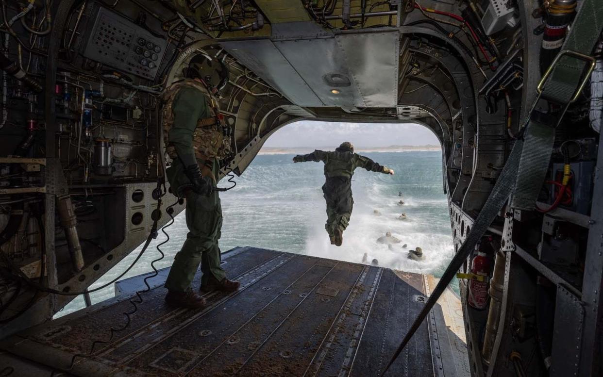 Royal Marines from 40 Commando practise 'helicasting' into the sea off the North Devon coast from a Chinook - RAF Odiham