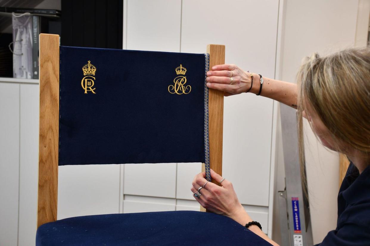 2pwgfrd mandatory credit required buckingham palace handout photo issued by buckingham palace of household staff making congregation chairs ahead of the coronation of king charles iii on may 6 issue date sunday april 30, 2023