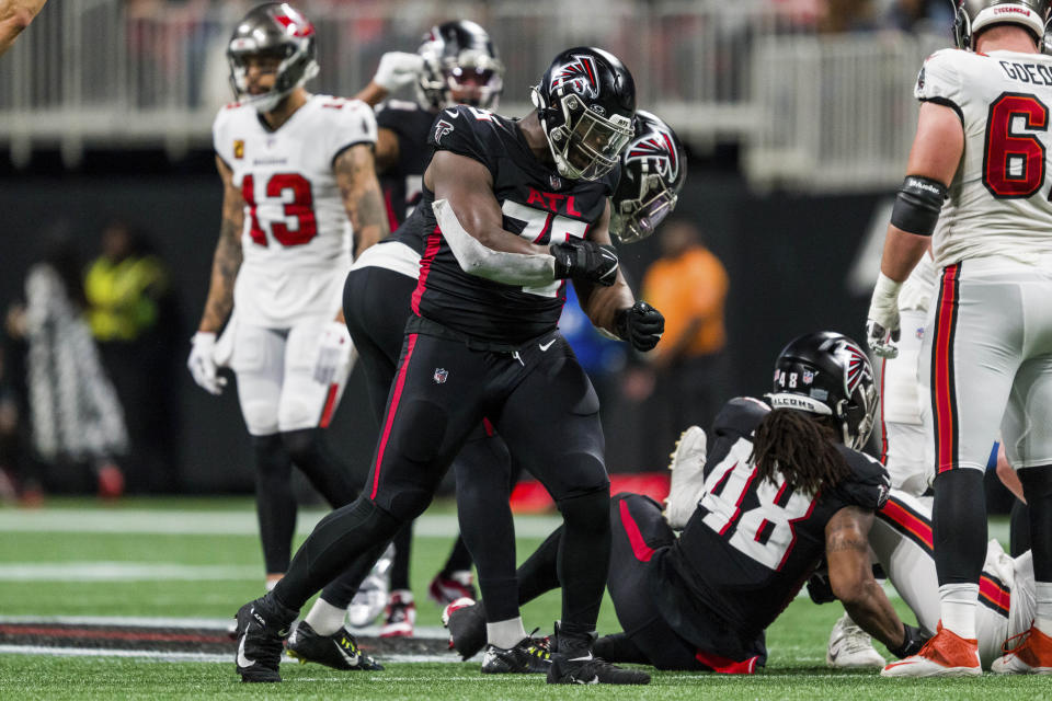 FILE - Atlanta Falcons defensive tackle Kentavius Street (75) reacts during the first half of an NFL football game against the Tampa Bay Buccaneers, Dec. 10, 2023, in Atlanta. Street will not play in Sunday’s game at Carolina as the Falcons battle injuries on both sides of their line as they battle for the lead in the jumbled NFC South. Coach Arthur Smith said Wednesday, Dec. 13, he is awaiting word on whether the injury will threaten Smith's status for the remainder of the season.(AP Photo/Danny Karnik, File)