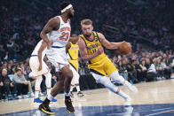 Indiana Pacers forward Domantas Sabonis (11) drives to the basket against New York Knicks center Mitchell Robinson (23) in the first half of an NBA basketball game, Friday, Feb. 21, 2020, at Madison Square Garden in New York. (AP Photo/Mary Altaffer)