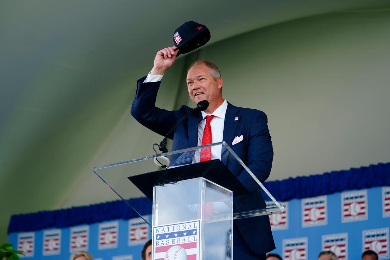 Scott Rolen tips his hat during his acceptance speech at the National Baseball Hall of Fame induction ceremony on Sunday.