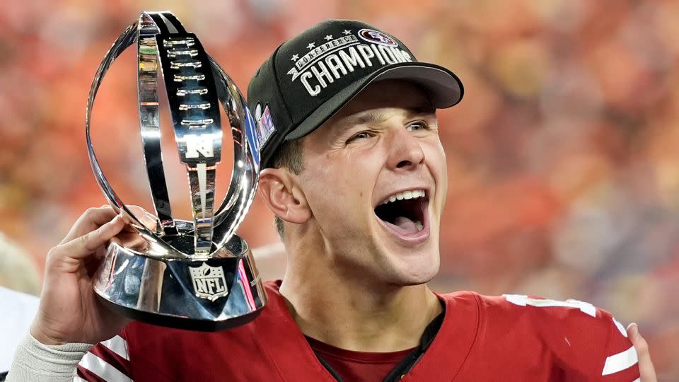 San Francisco 49ers quarterback Brock Purdy celebrates with the trophy after their win against the Detroit Lions in the NFC Championship on Sunday. - David J. Phillip/AP