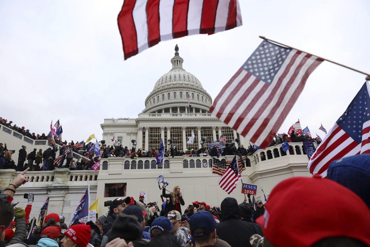 FILE - In this Wednesday, Jan. 6 photo, supporters of President Donald Trump gather outside the U.S. Capitol in Washington. 