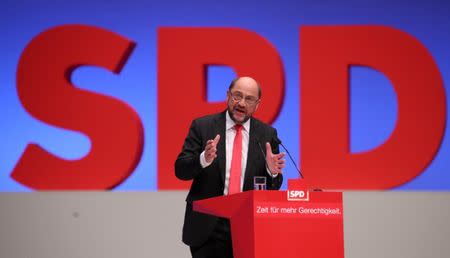 German Chancellor candidate Martin Schulz of the Social Democratic party (SPD) delivers his speech at the party convention in Dortmund, Germany, June 25, 2017. The text reads "Time for more justice". REUTERS/Wolfgang Rattay