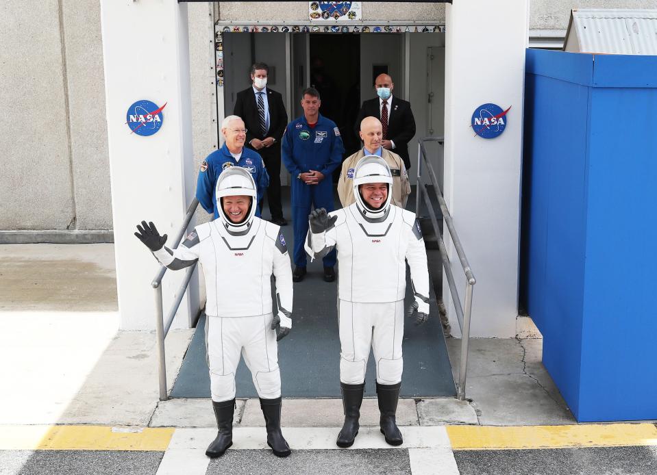 Doug Hurley and Bob Behnken on their way to the SpaceX Falcon 9 rocket at the Kennedy Space Center, May 27, 2020.