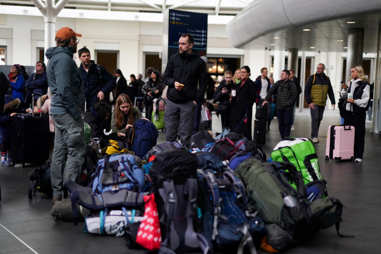 Passengers waiting for trains at London King's Cross Station as the getaway continues for the Easter weekend (Jordan Pettitt/PA Wire)