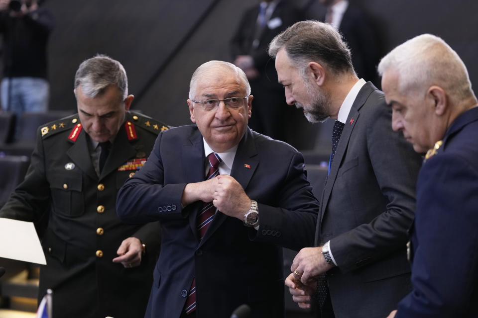 Turkey's Defense Minister Yasar Guler, second left, speaks with members of his delegation during a meeting of the North Atlantic Council in defense ministers session at NATO headquarters in Brussels, Thursday, Feb. 15, 2024. (AP Photo/Virginia Mayo)