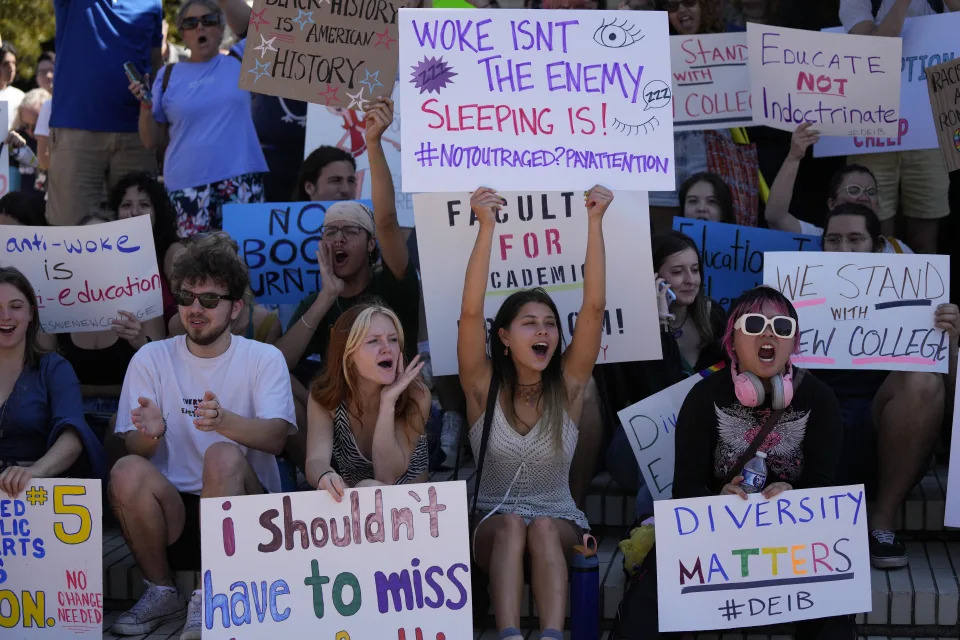 New College of Florida students and supporters protest ahead of a meeting by the college's board of trustees, Tuesday, Feb. 28, 2023, in Sarasota, Fla. The conservative-dominated board of trustees of Florida's public honors college was meeting Tuesday to take up a measure making wholesale changes in the school's diversity, equity and inclusion programs and offices. (AP Photo/Rebecca Blackwell)